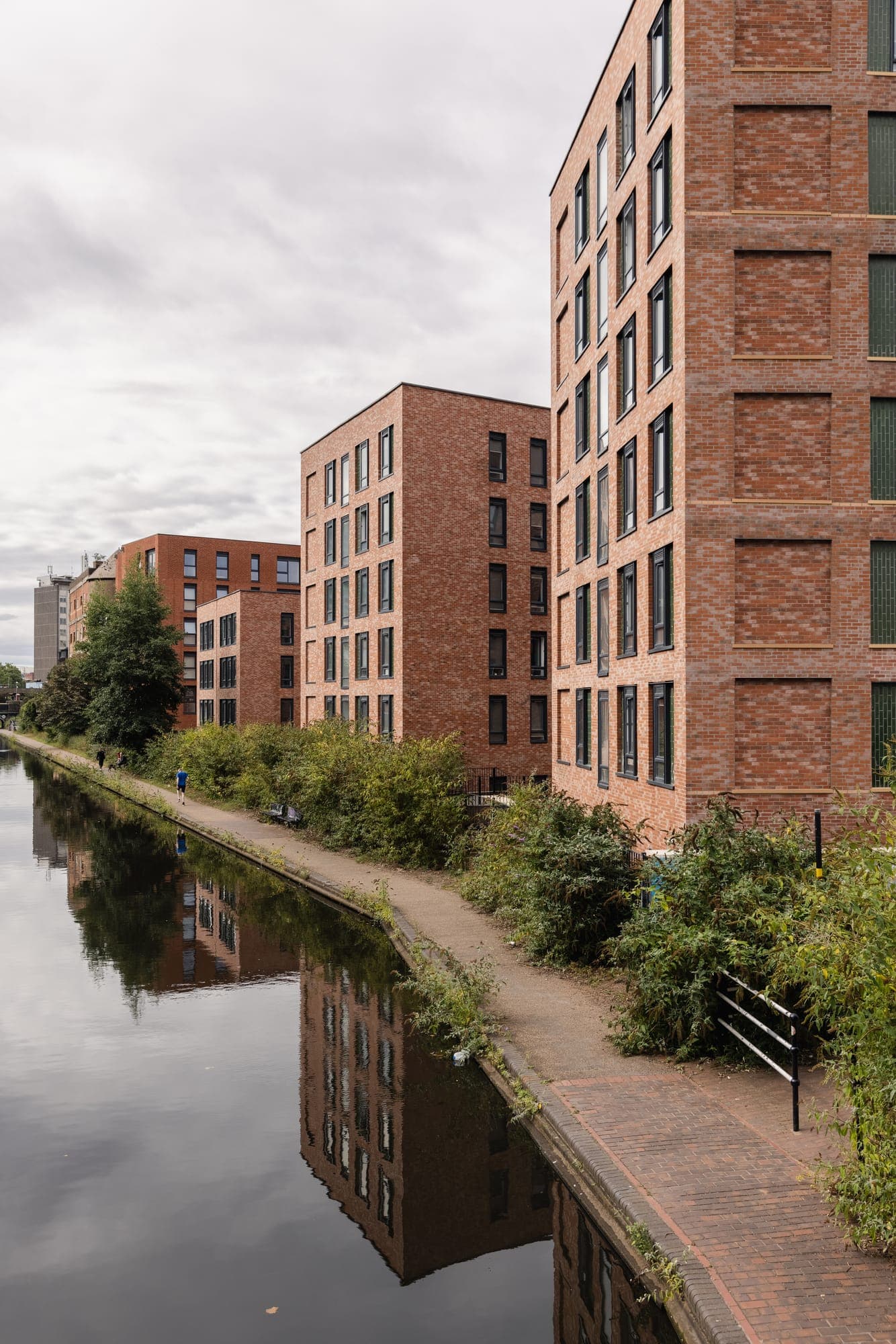Looking along the canal towpath beside Globe Works towards the city
