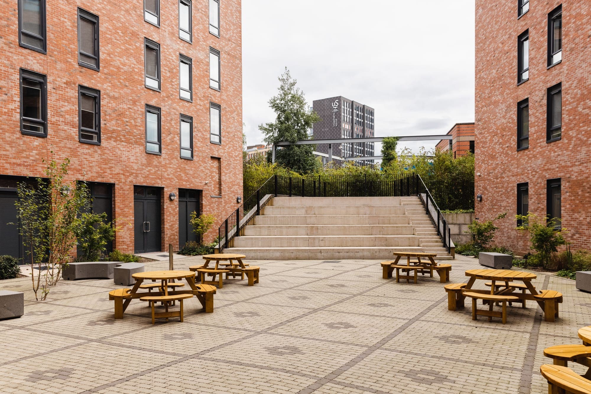 Picnic benches in the courtyard at Globe Works