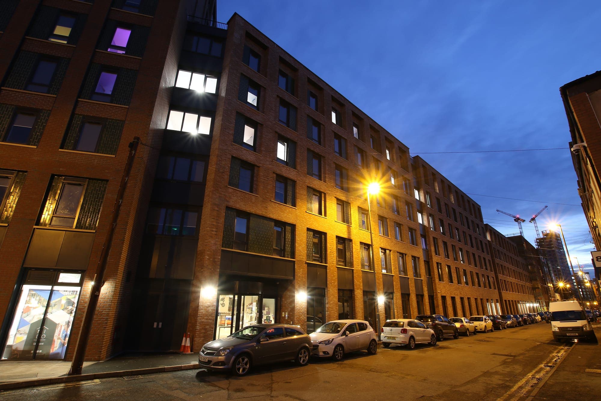 Globe Works at dusk from Cliveland Street, with the windows lit