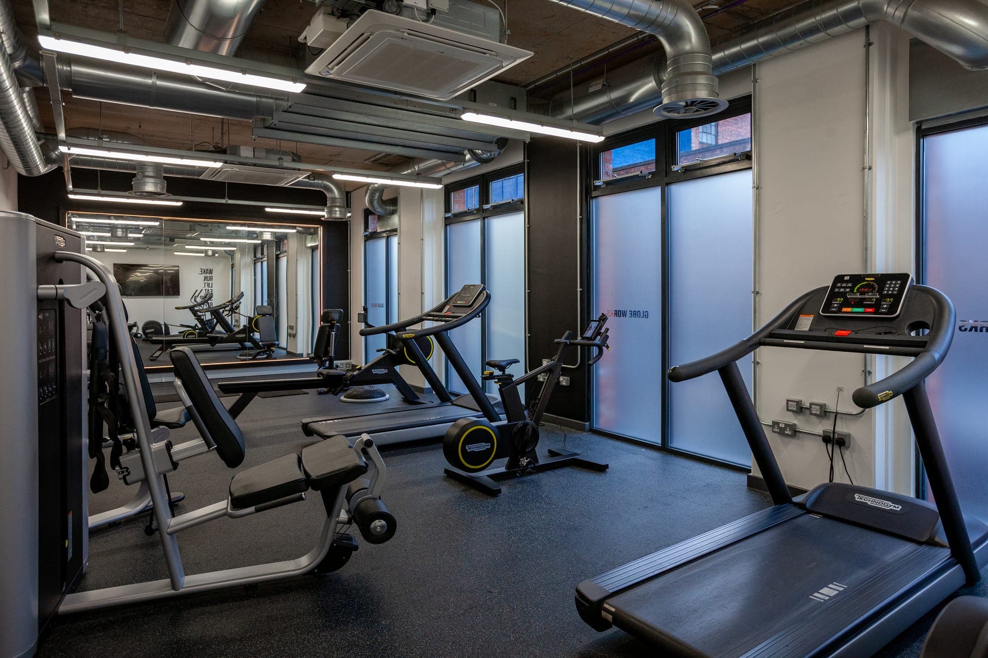 Weights and resistance machines in the gym at Globe Works